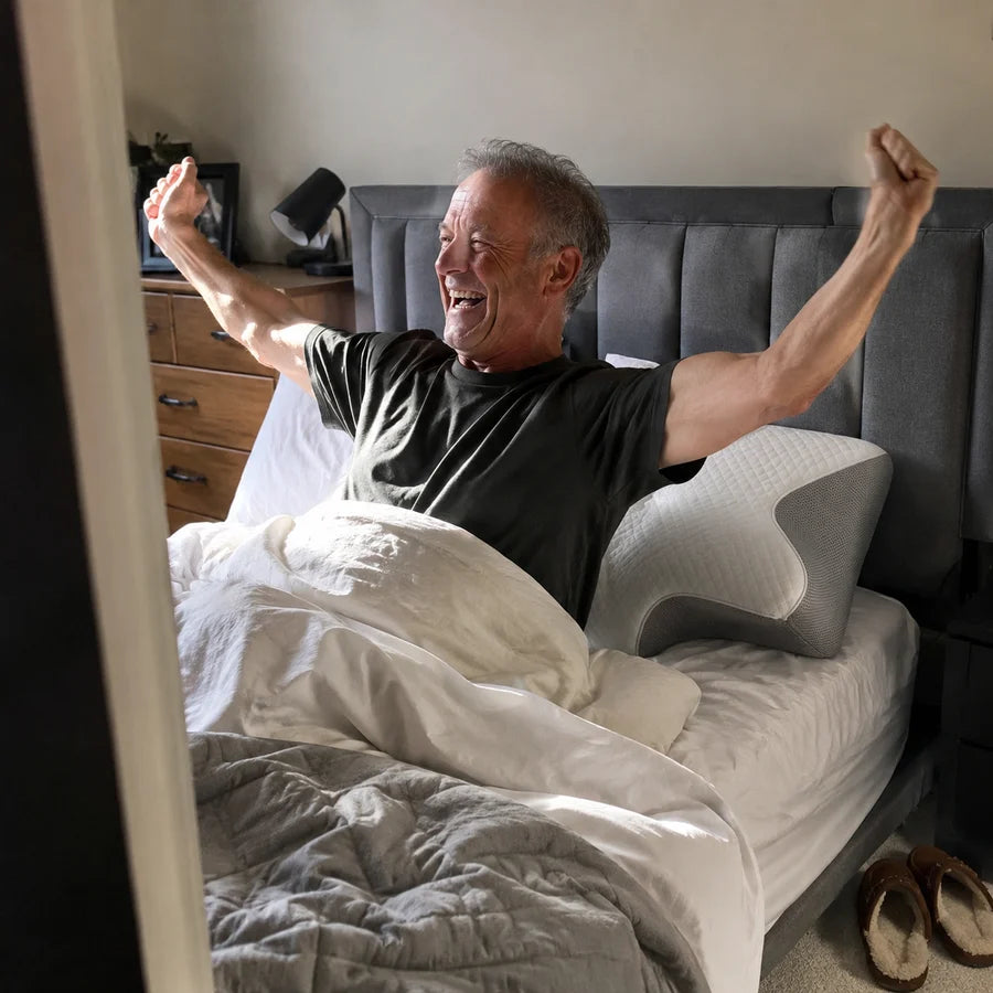 Customer stretching in bed in the morning